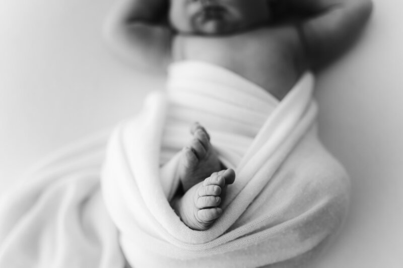 A close up of a newborns feet
