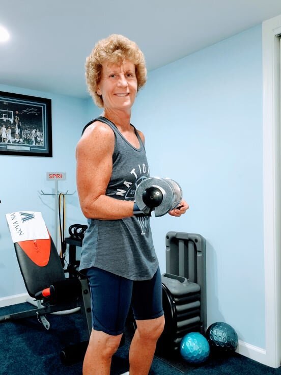 Helen Ann lifting weights during an at-home workout