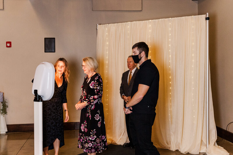 A wedding guest using a photo booth during a wedding at The Silo in Hopkinsville, TN