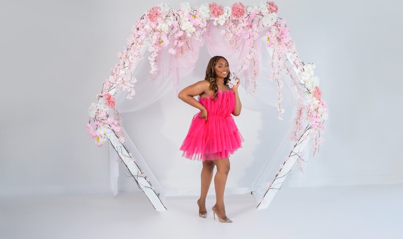 women in pink tutu dress and garden arch dallas studio birthday photoshoot