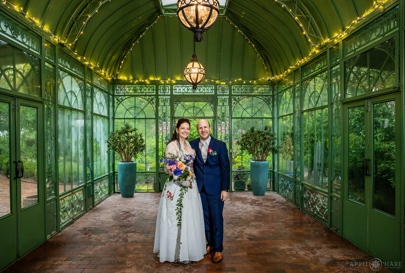 Couple photographed inside the Woodland Mosaic Gardens historic greenhouse at Denver Botanic Gardens