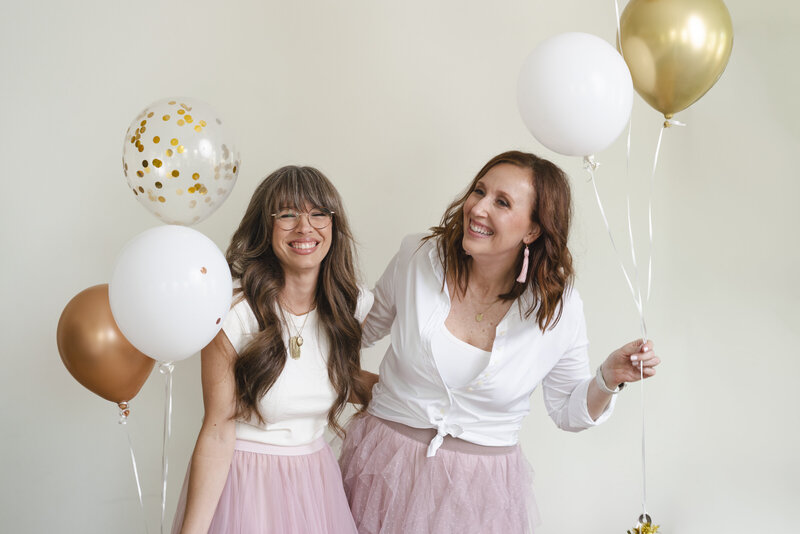 women-business-owners-laughing-with-balloons-for-brand-session-Charleston