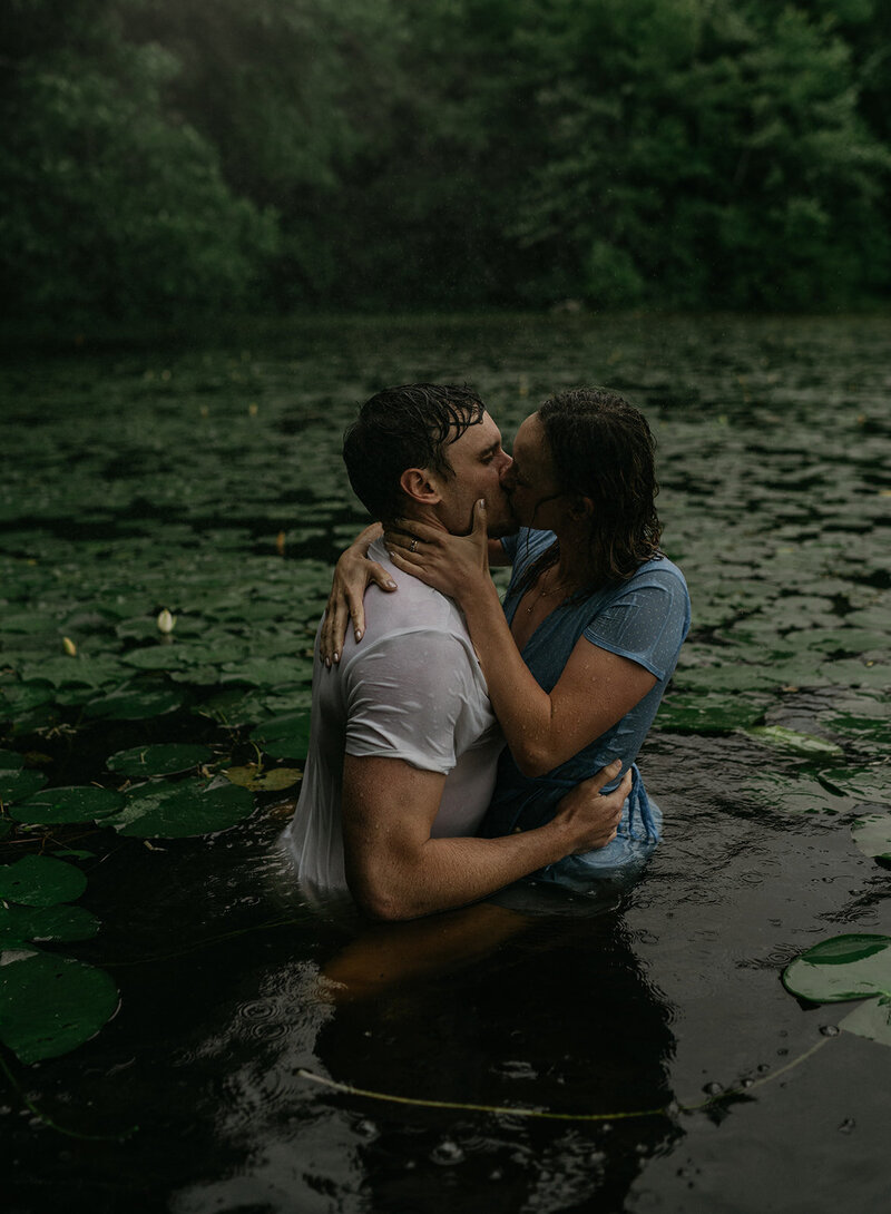Rhode Island and Destination Wedding Photographer | Cinematic, Moody, Storytelling | Aisha Lee Photography | Couple kissing on the lake