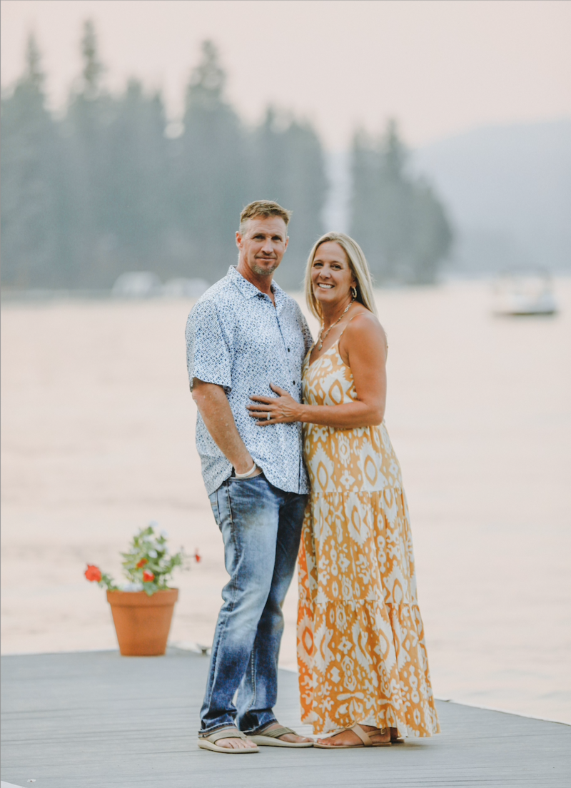 couple posing near lake