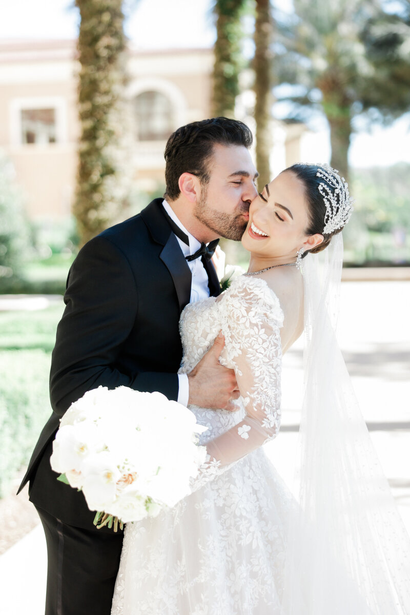 Bride and groom portrait at a wedding at the four seasons Orlando by Florida wedding photographer.