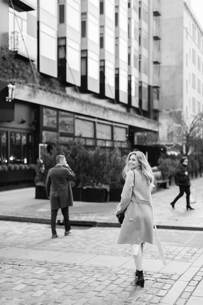 girl-walking-cobblestone-street-manhattan