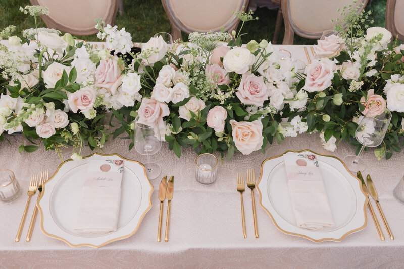 A pink and gold table setting for a Hamptons wedding