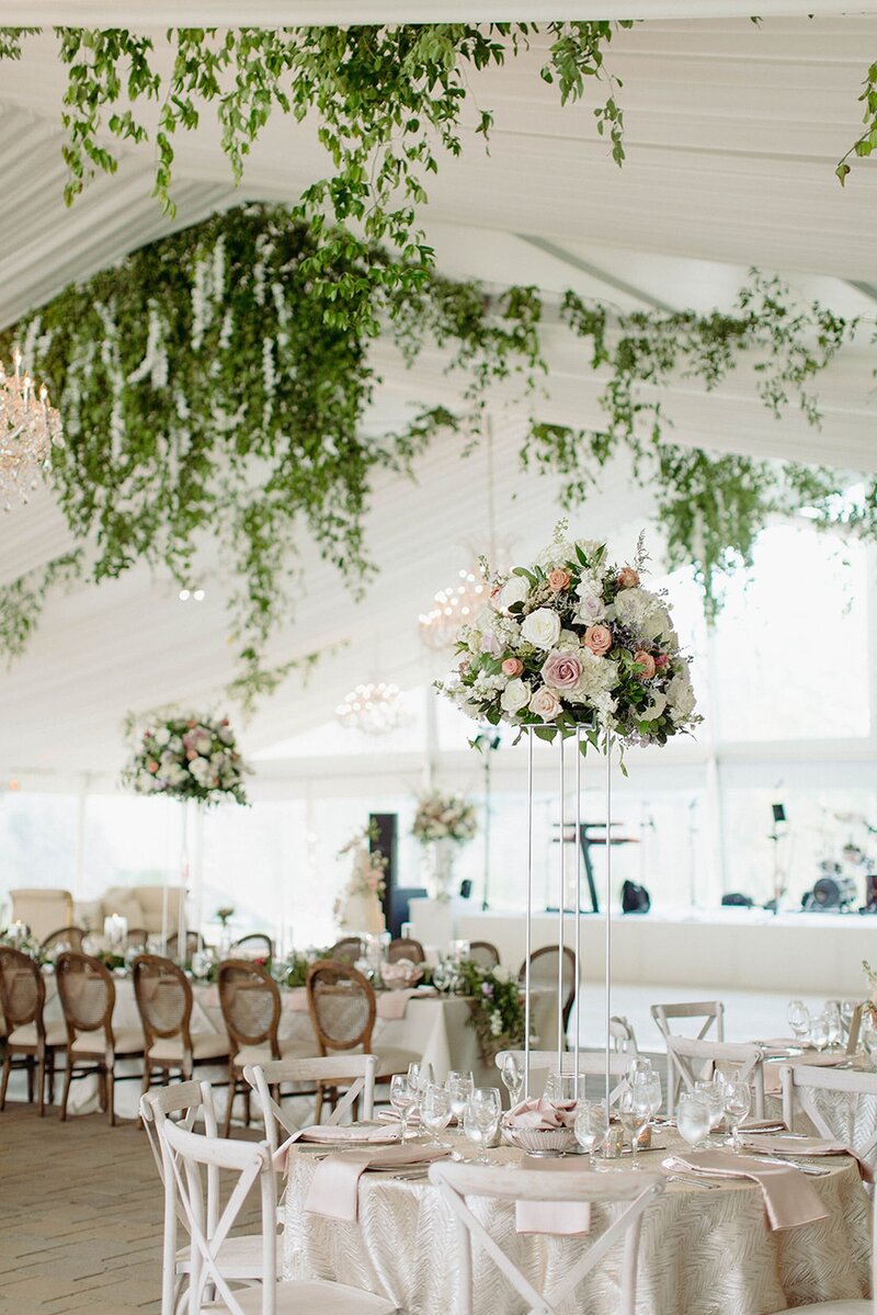 Wedding reception table adorned with a floral centerpiece for a wedding in Cincinnati