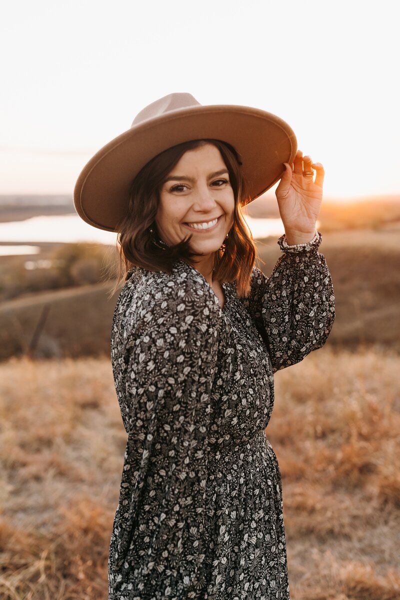Lady in hat smiling for portrait photos