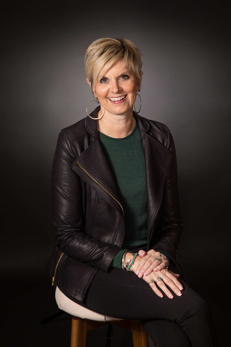 Realtor sitting for professional headshots in a photography studio