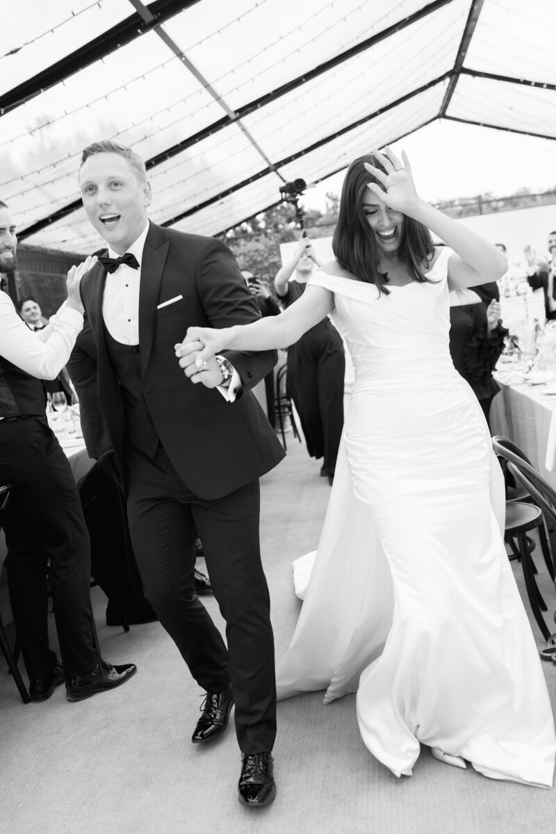 Bride and groom enter their reception