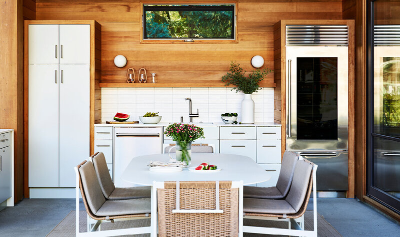 Boston kitchen designer creates a new construction Hingham outdoor kitchen with modern metal cabinets, warm wood details, and sleek entertaining space.