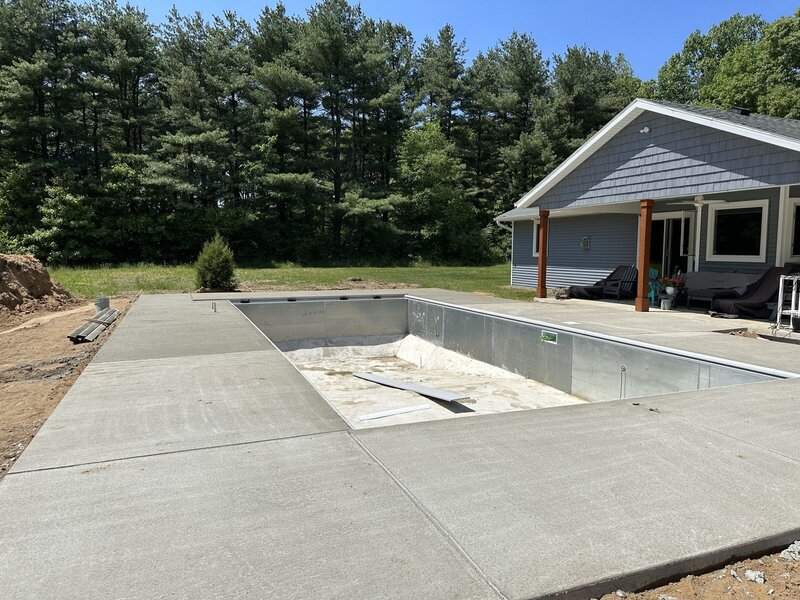 Finished broom-finish concrete deck around a new in-ground pool in Elkhart, IN