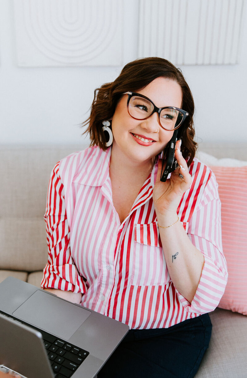 Copywriter Sara Gillis wearing a jean jacket and floral dress