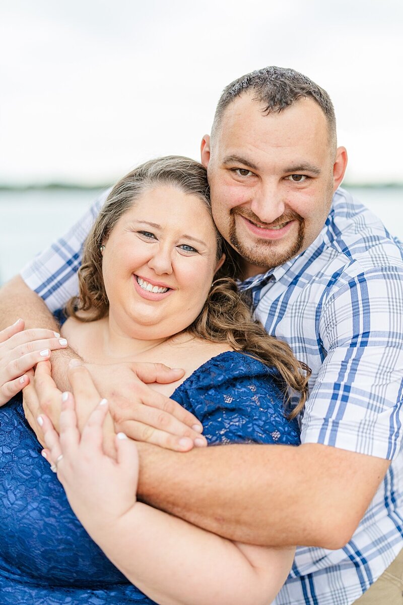 guy-hugging-girl-from-behind-st-clair-boardwalk