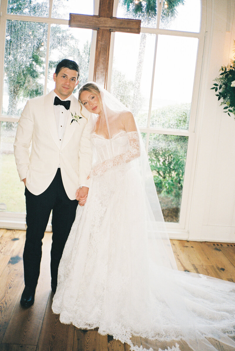 Newlyweds standing at the altar after getting married inside the chapel