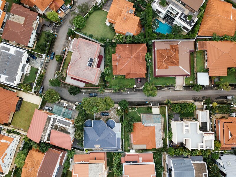 Aerial view of houses showcasing lucrative opportunities for real estate investments.