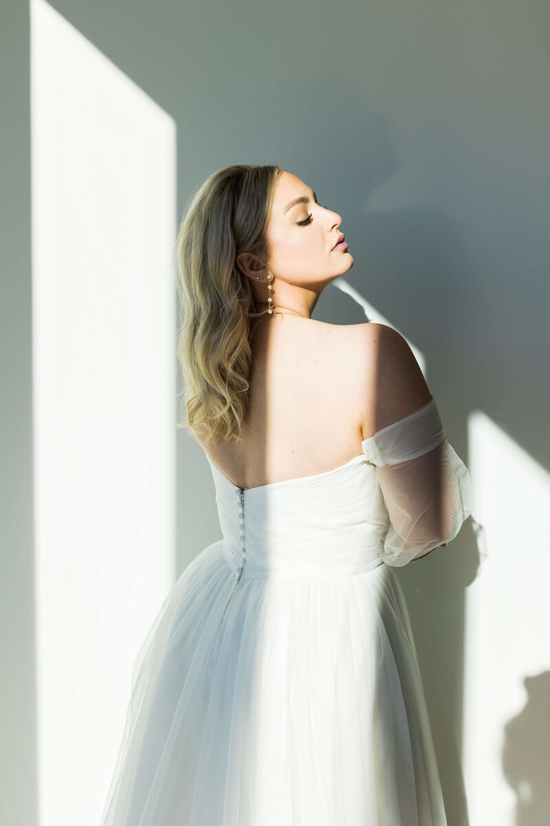 Bridal portrait in with shadows on wall