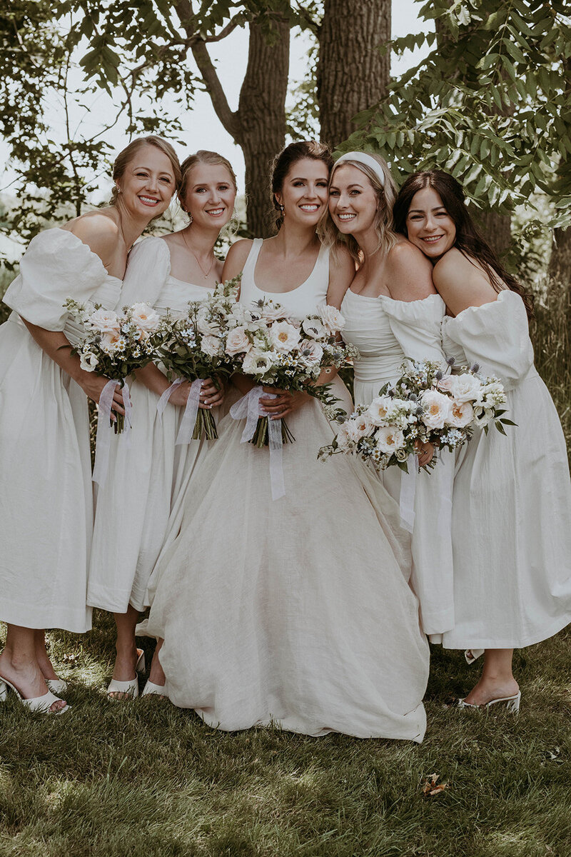 wedding tablescape with place settings and flowers at Bayfield Town Hall