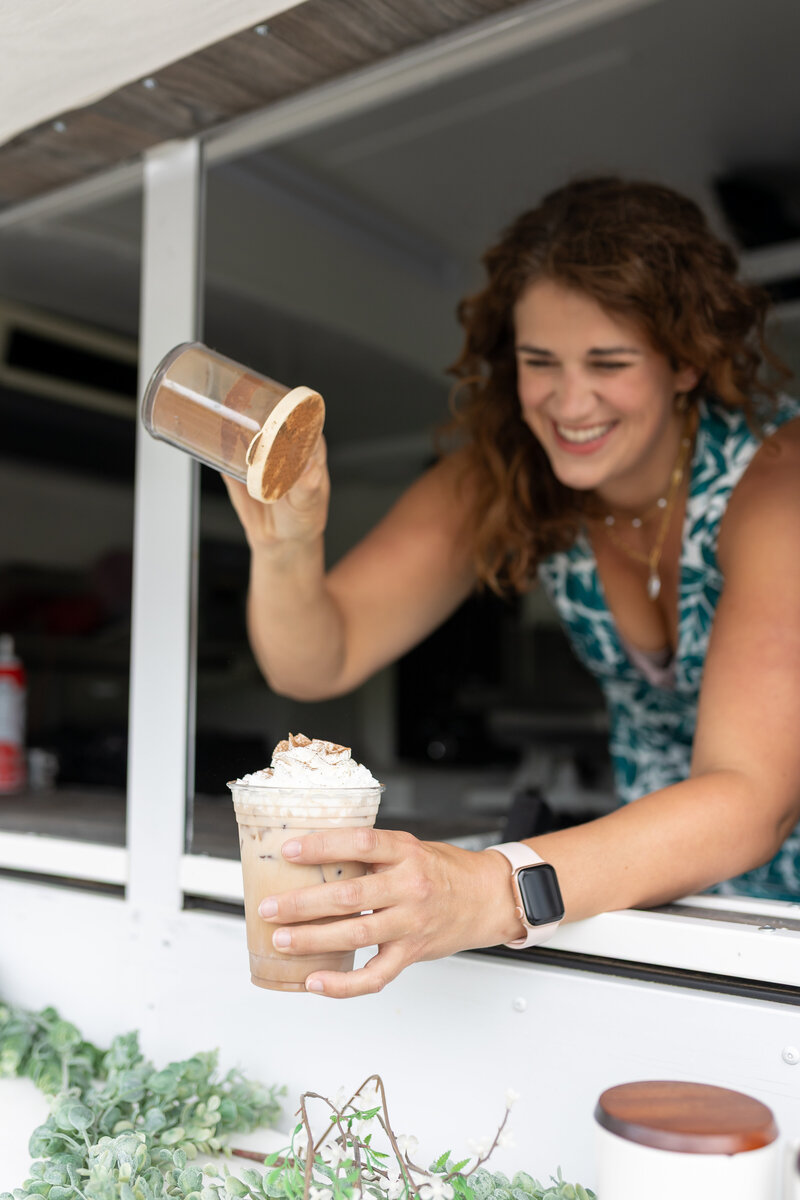 Rachel serving a chai latte