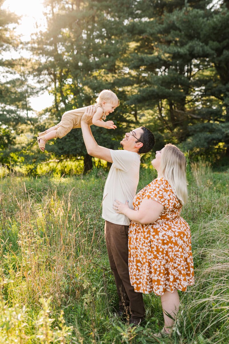 A family posing for fall mini sessions in park