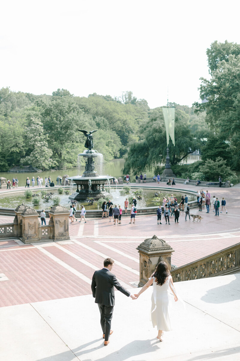 couple-walking-central-park-engagement
