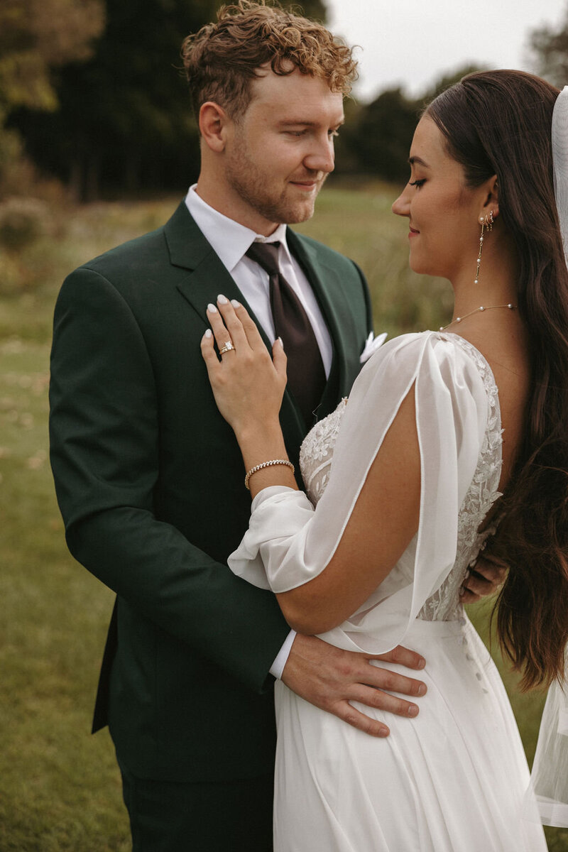 Bride and groom sharing a moment during their wedding session in Michigan