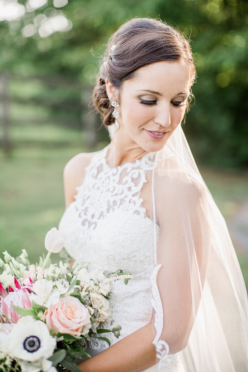 bride looking over shoulder by Knoxville Wedding Photographer, Amanda May Photos
