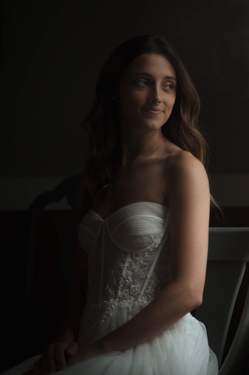 Bride waiting as the rain storm passes, photographed by Kristen Vann
