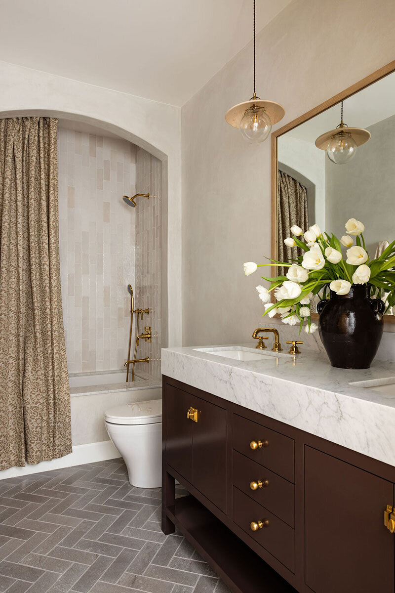 Bathroom with wood console and elevated design in a Costa Mesa home
