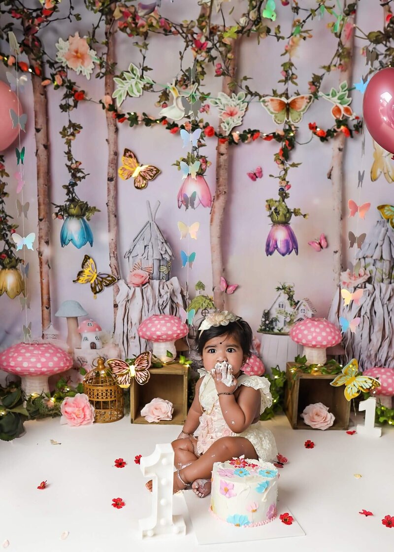 Cute fairy 1st birthday session with this cutie demolishing her cake.