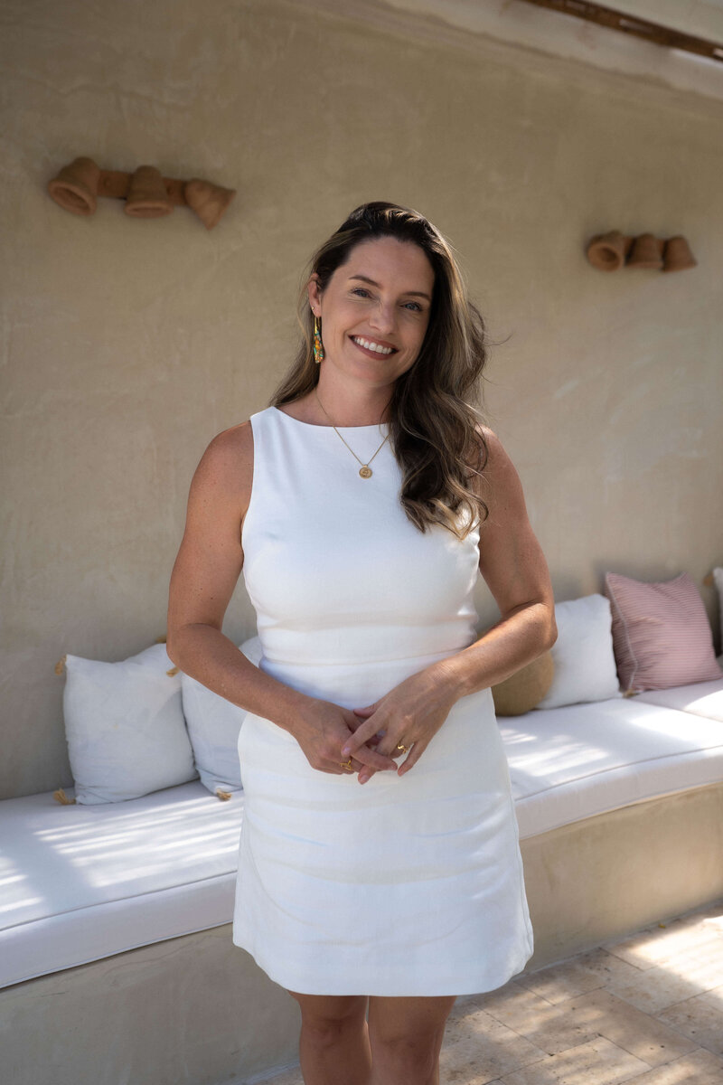 Castilia smiling in a cozy home setting, parent coach and founder of Raising Our Future.