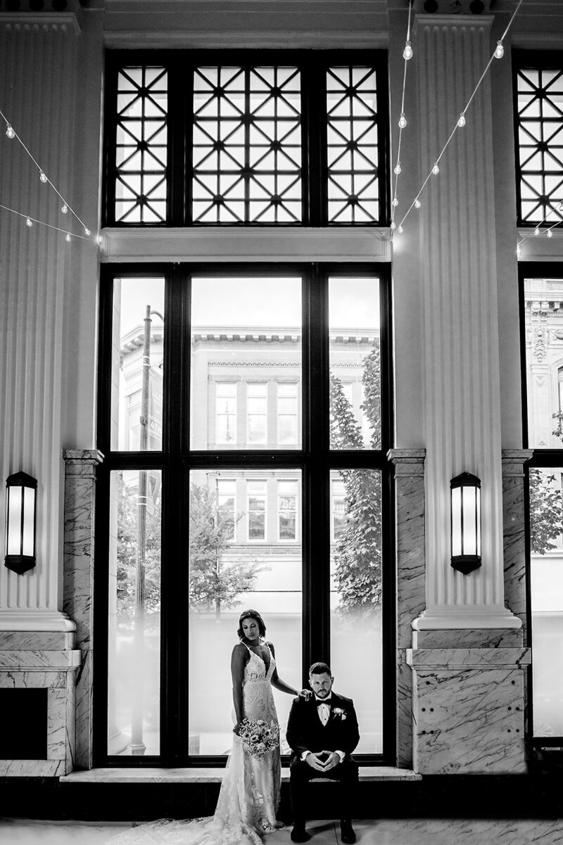 Bride and groom sitting in citizens ballroom captured by Baltimore photographers