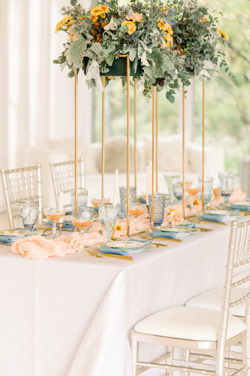 peach and green wedding reception tablescape
