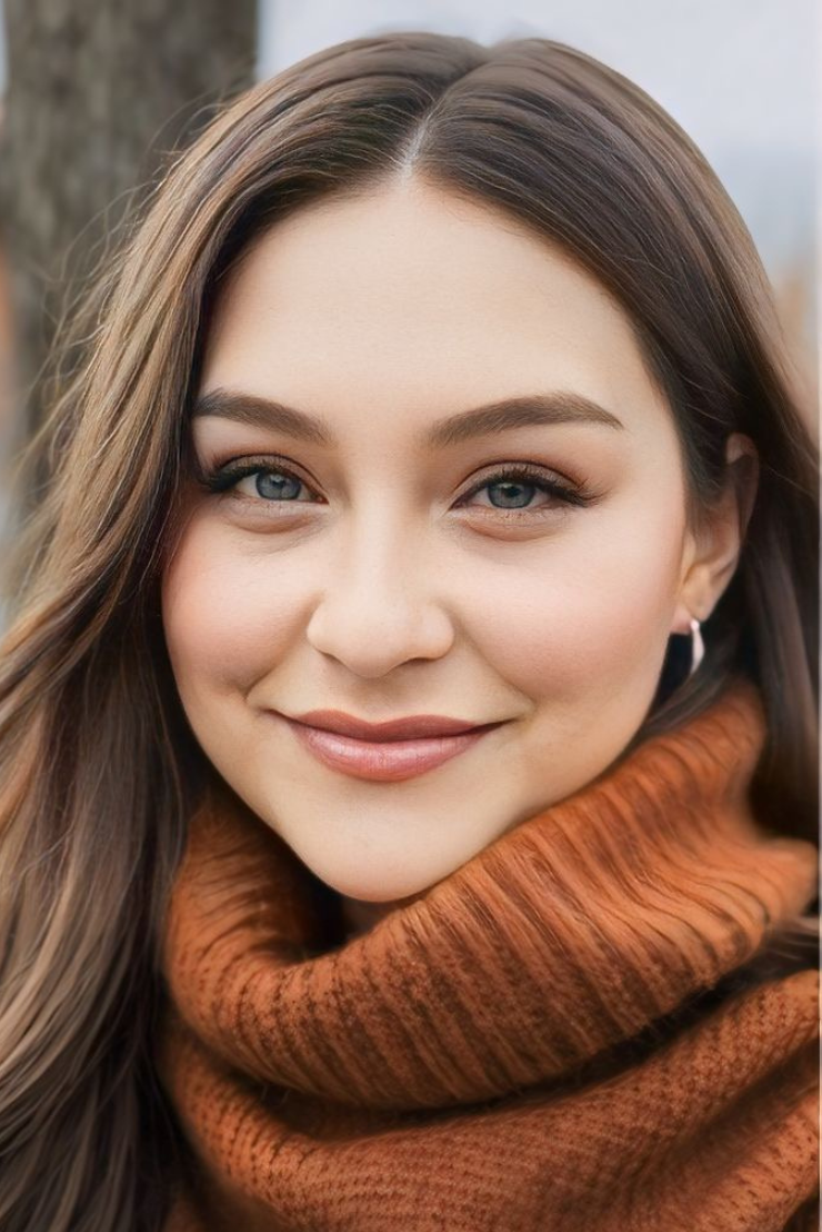 An image of the founder of August Wellness dressed in an orange turtleneck sweater.