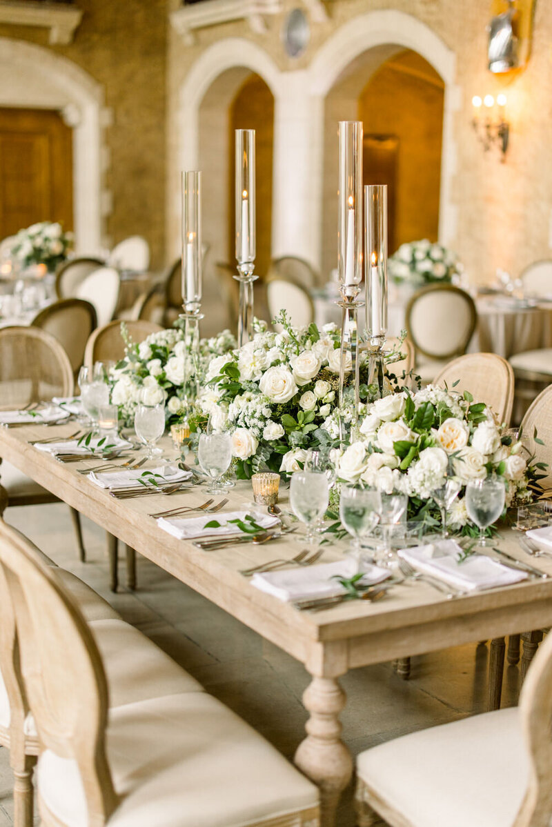 This elegant photograph captures the beautifully arranged reception tables and intricate details inside Mount Stephen Hall at the Banff Springs Hotel. The historic grandeur of the hall complements the luxurious table settings, creating a refined and sophisticated atmosphere for the celebration.