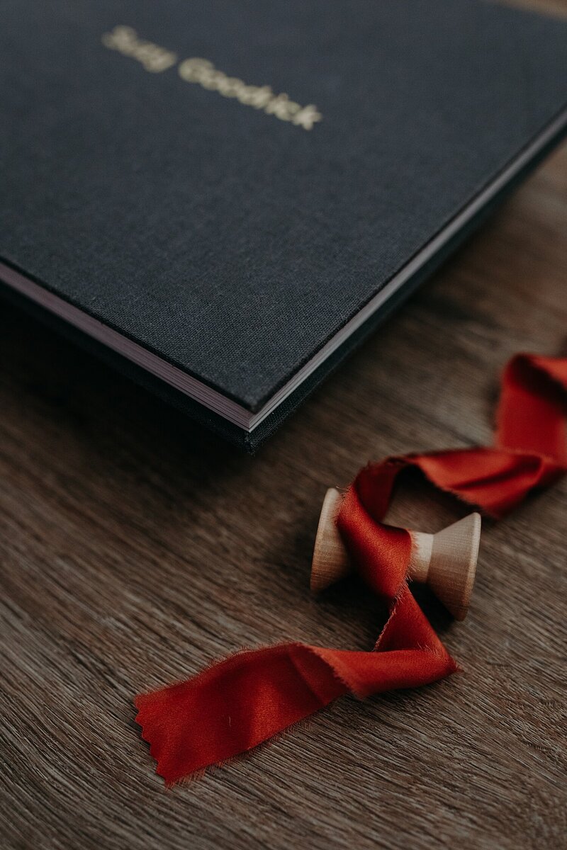 Wedding album styled with ribbon and flowers