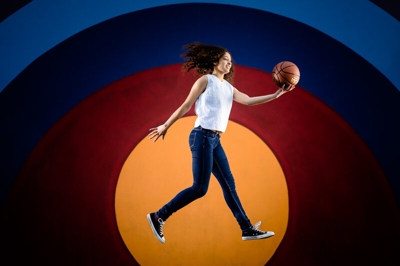portrait-senior-highschool-sports-color-jumping-basketball