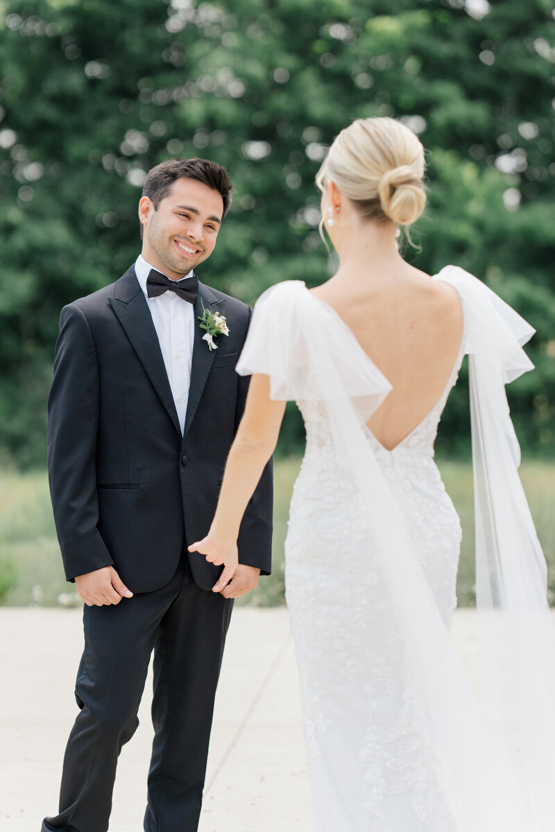 bride and groom walking photographed by ashleigh grzybowski a cincinnati wedding photographer