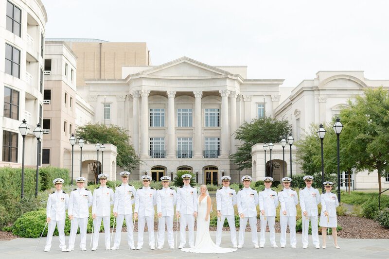 Swords arch men dressed in military choker whites at a Charleston wedding