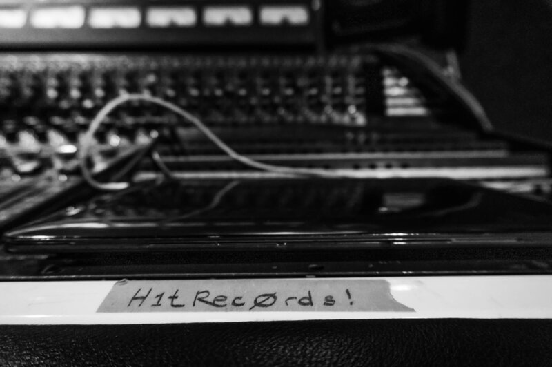 Black and white photo of music studio equipment with Hit Records tape