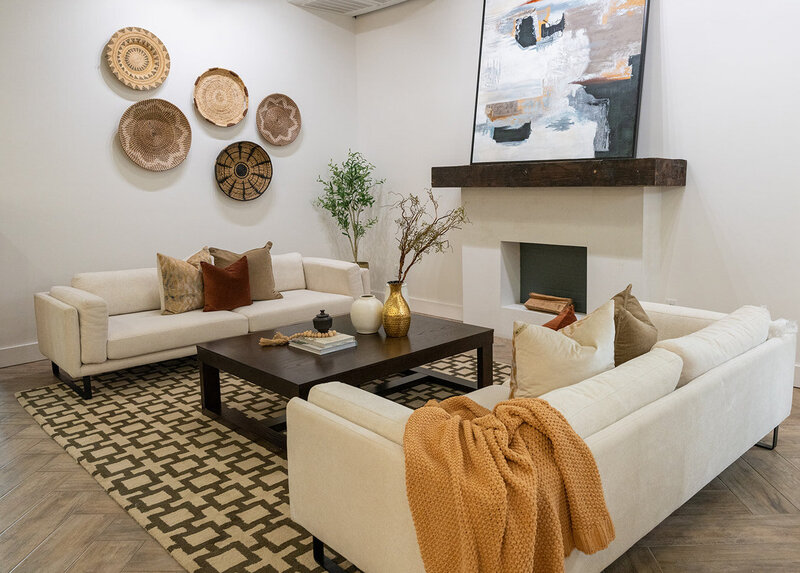 2 couches facing each other with coffee table and fireplace