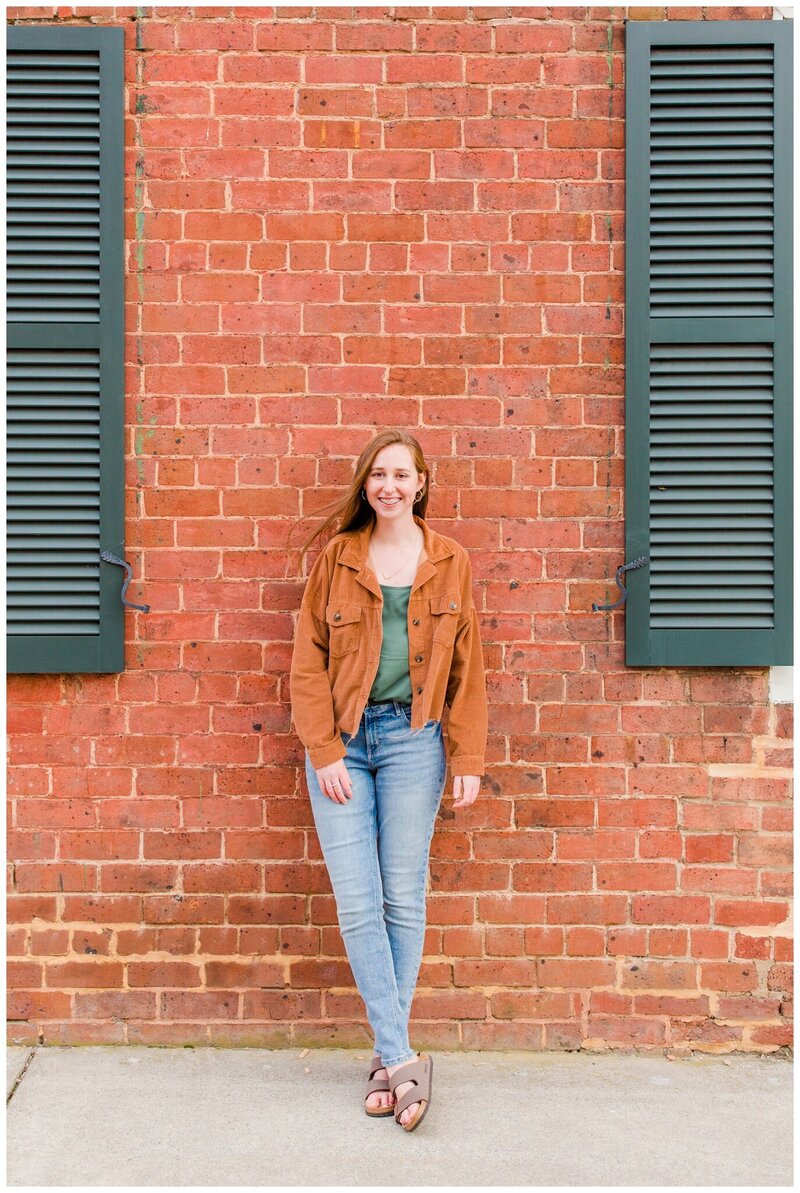 Natural and joyful senior portrait session at JMU, showcasing the beauty of campus and student life