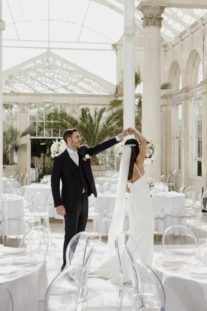 Bride and Groom dancing in the Syon Park orangery