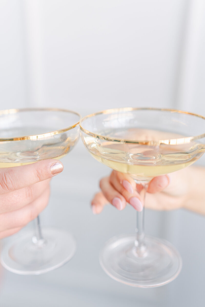 gold cocktail glasses, pink nails, wedding details, elegant wedding details