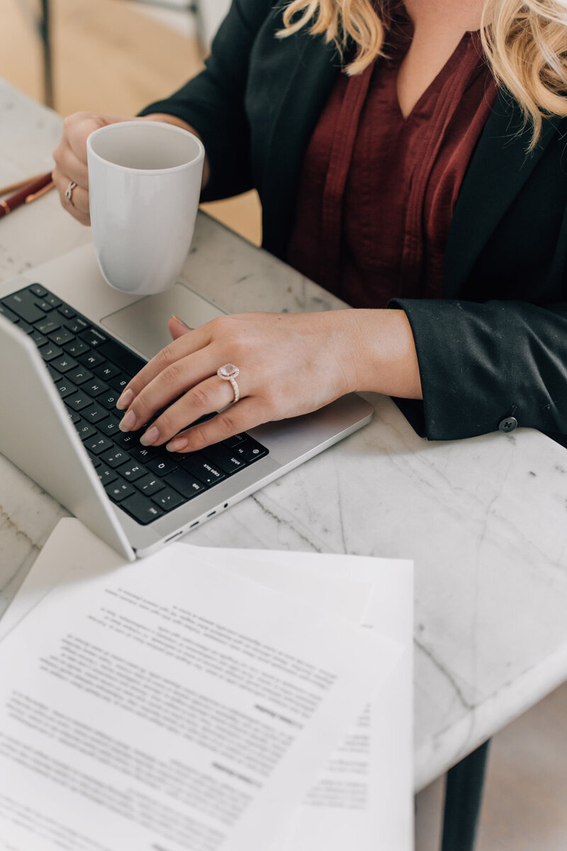 Lawyer typing on laptop