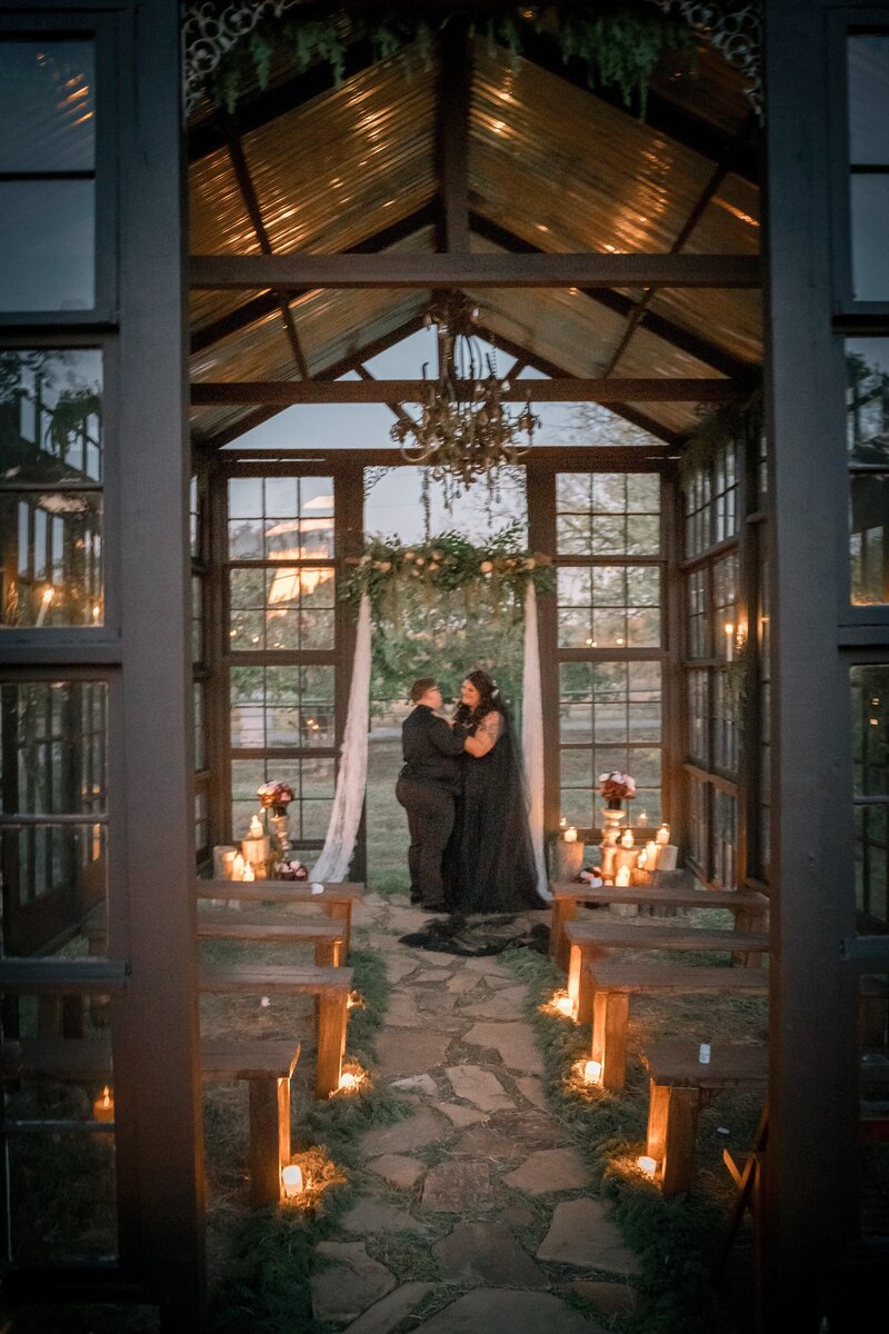 Beautiful wedding ceremony under the trees at the forever farm