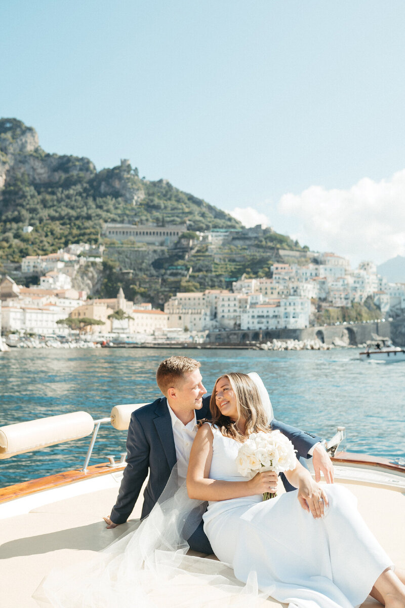 newly-weds-cuddling-on-boat