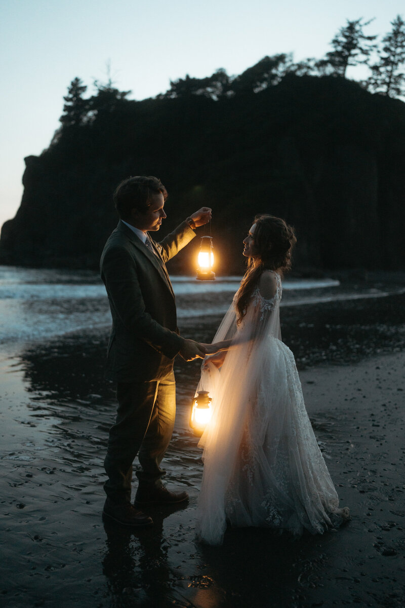 Wedding couple laughing and walking on the beach during their Olympic National Park Wedding