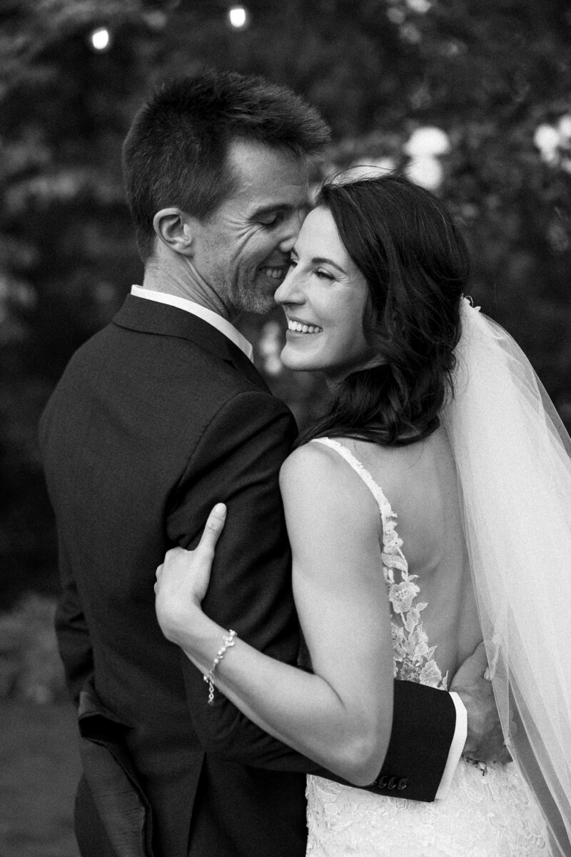 A bride and groom sharing an intimate moment, capturing the love and connection on their wedding day. Girasole & Co. Weddings, a top wedding planner in Columbus, Ohio, specializes in crafting personalized, seamless wedding experiences that reflect your unique love story. Let us help you create a meaningful and unforgettable celebration with expert planning and attention to every detail.